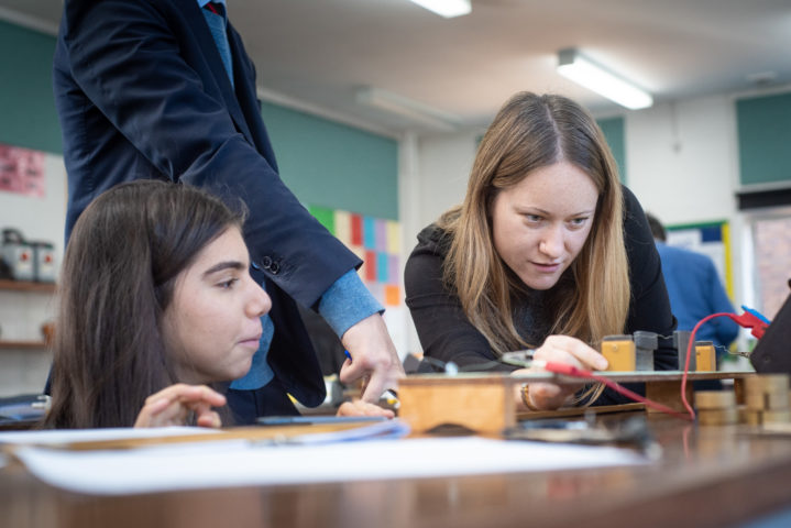 Girls study Physics in classroom at Magdalen College School