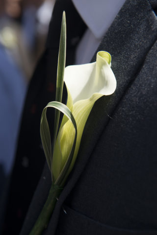 Lily flower on Magdalen College School pupil's lapel, symbol of Magdalen College School motto 'Sicut Lilium'
