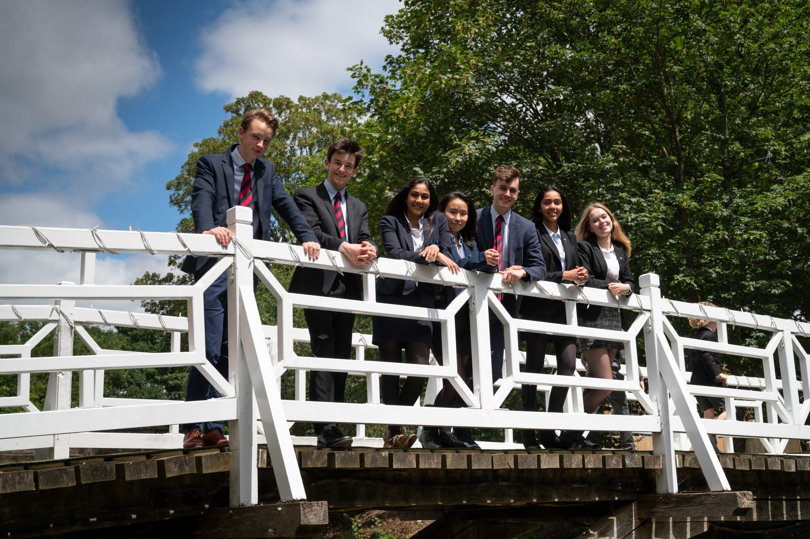 Magdalen College School Sixth Form pupils on white bridge