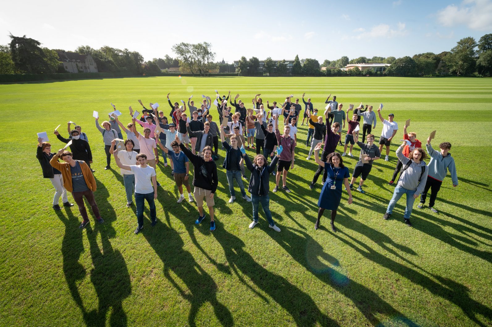 Magdalen College School pupils and Master Helen Pike celebrating GCSE exam results 2020