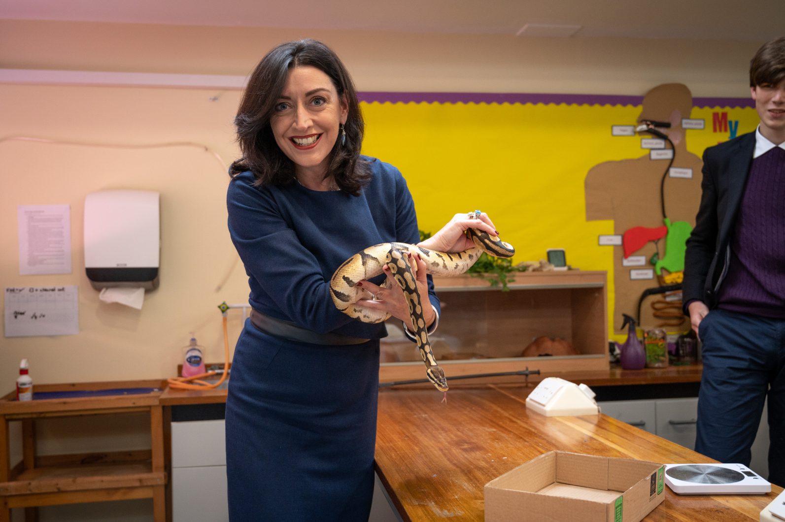 Master of Magdalen College School, Helen Pike, holding snake