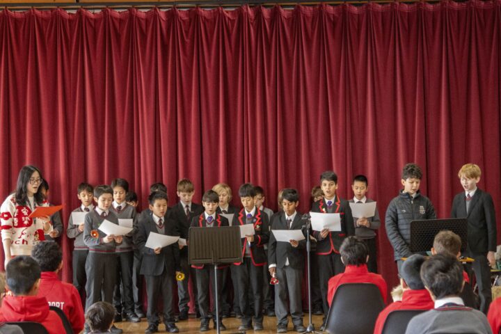 Junior School celebrating Chinese New Year by performing the traditional song, “Gong Xi Gong Xi.”
